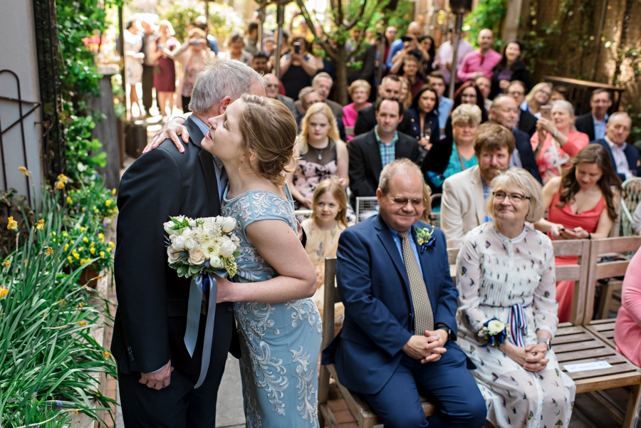 A bride hugs her father during her wedding ceremony at Talula's Garden in Philadelphia.